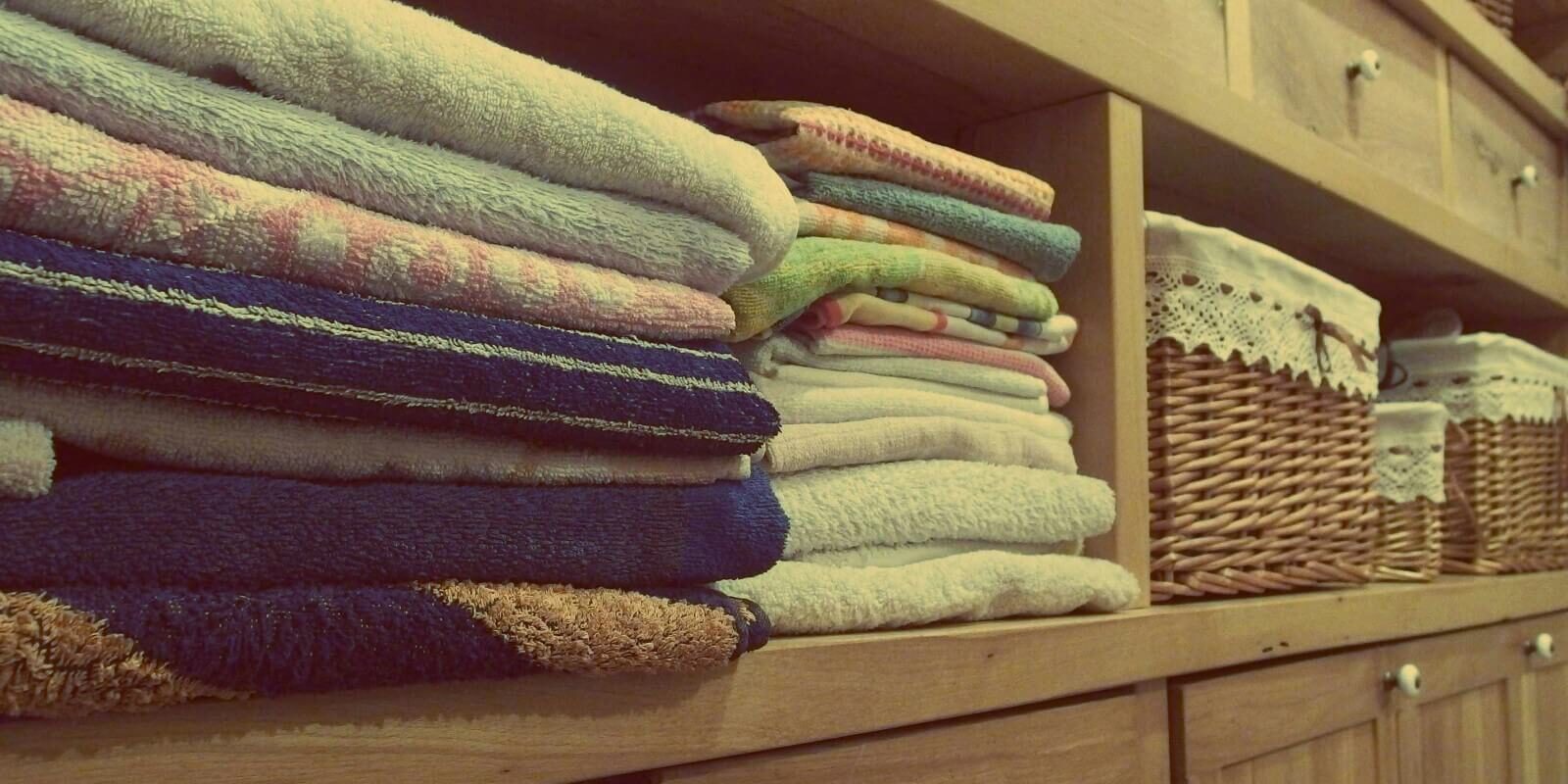residential-cleaning-stacked-towels-and-baskets